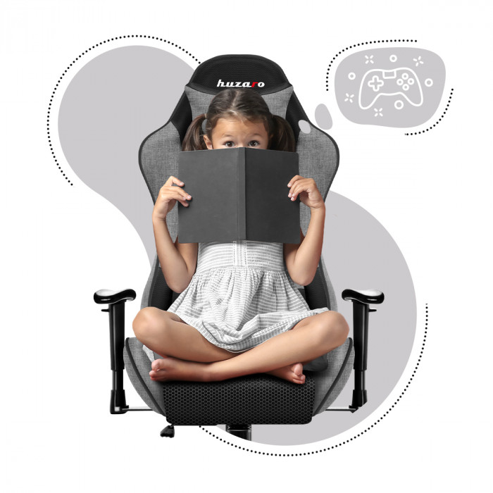 A girl sitting on the Huzaro Ranger 6.0 Grey Mesh gaming chair holding an open book in her hands