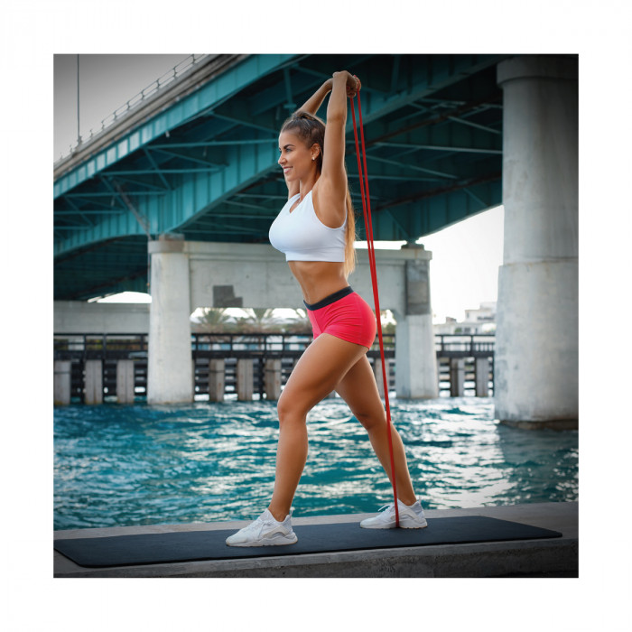 Woman exercising with elastic bands Mark Adler