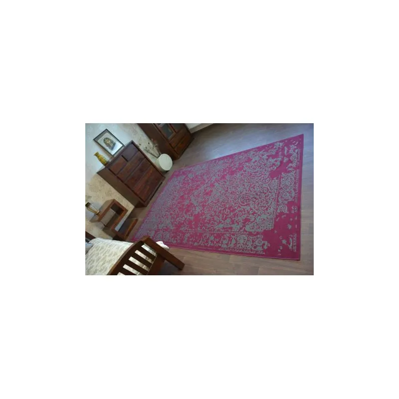 Vintage rug with a classic pattern, great for the bedroom or office
