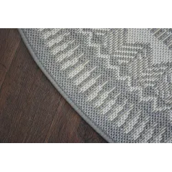 Circular sisal carpet in grey, suitable for living rooms