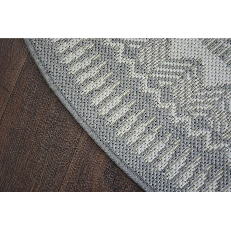 Circular sisal carpet in grey, suitable for living rooms