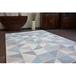 Soft blue rug, ideal for a child's room or play area