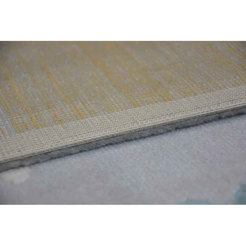 Garden rug in grey and cream with turquoise accents
