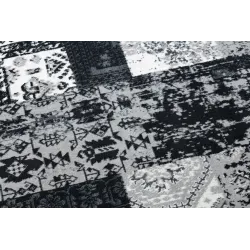 Soft patchwork rug, cozy addition for bedroom comfort