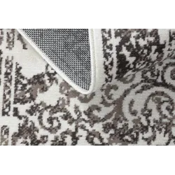 Beige vintage rug, perfect for outdoor or patio use
