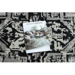Stylish vintage rug in grey and black, perfect for the living room