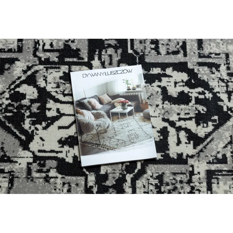 Stylish vintage rug in grey and black, perfect for the living room