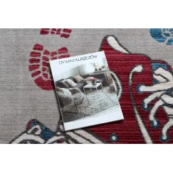 Modern children's rug in grey and red, perfect for a child's room