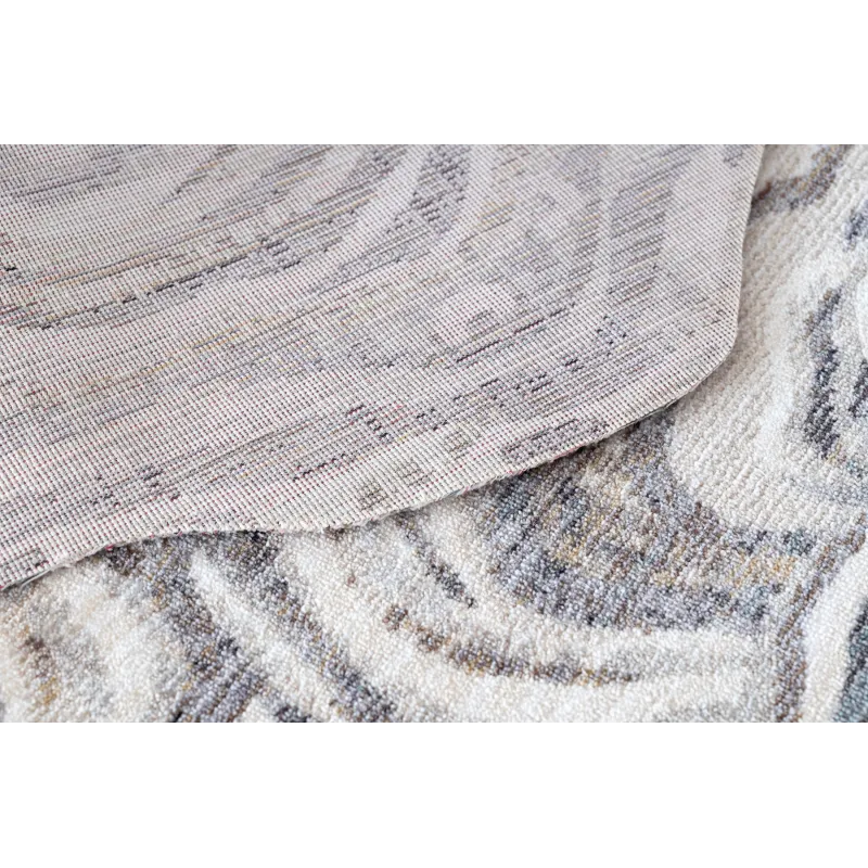 TINE 75426A rug with an irregular modern shape, made of durable polyester