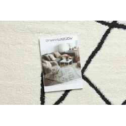 Stylish abstract rug in cream and black, perfect for modern living spaces