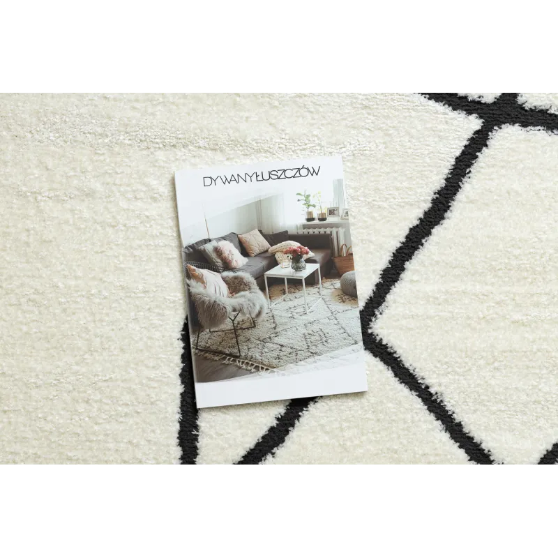 Stylish abstract rug in cream and black, perfect for modern living spaces