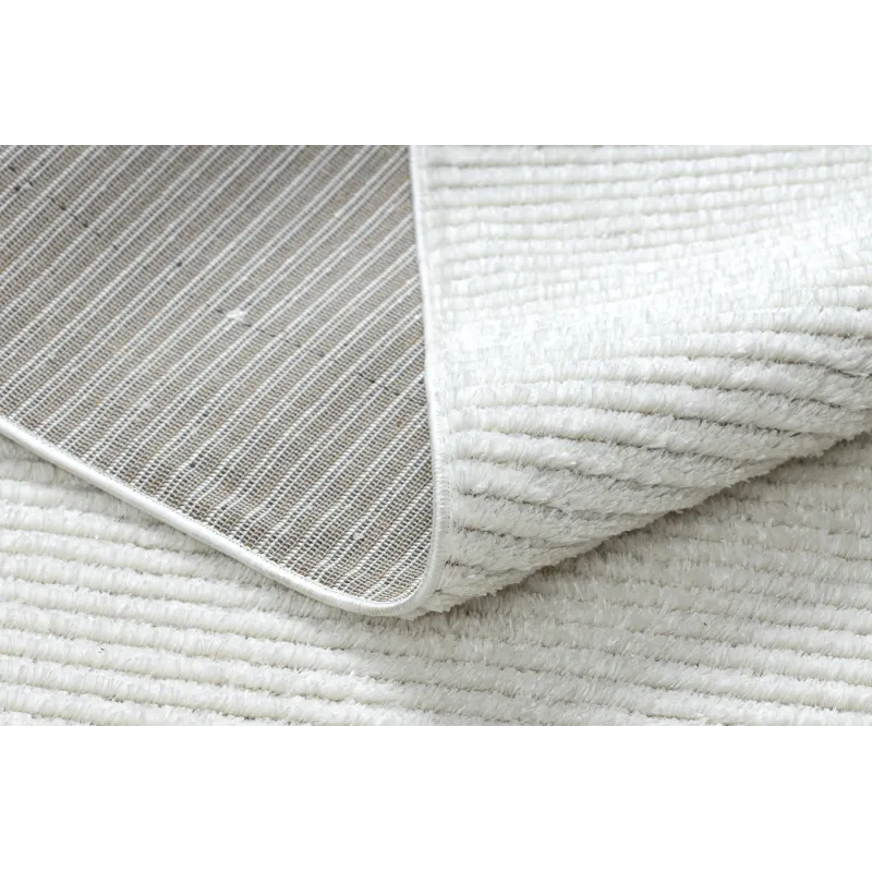 Cream rug for the bedroom, perfect for relaxation