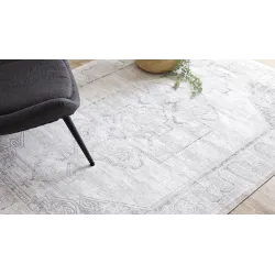 Modern rug in shades of grey with an ornamental design
