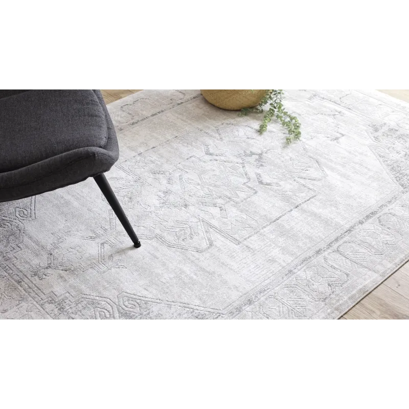 Modern rug in shades of grey with an ornamental design