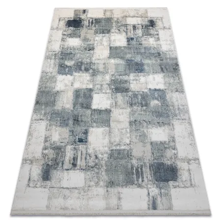 Modern blue geometric rug with fringes, perfect for living room decor
