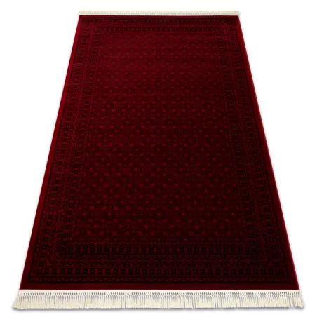 Oriental classic rug in burgundy with fringe, traditional design