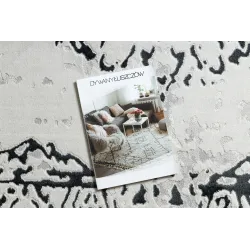 Elegant rug in white and grey tones