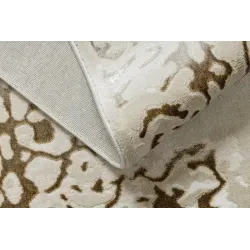 Modern rug for the living room in cream and gold tones