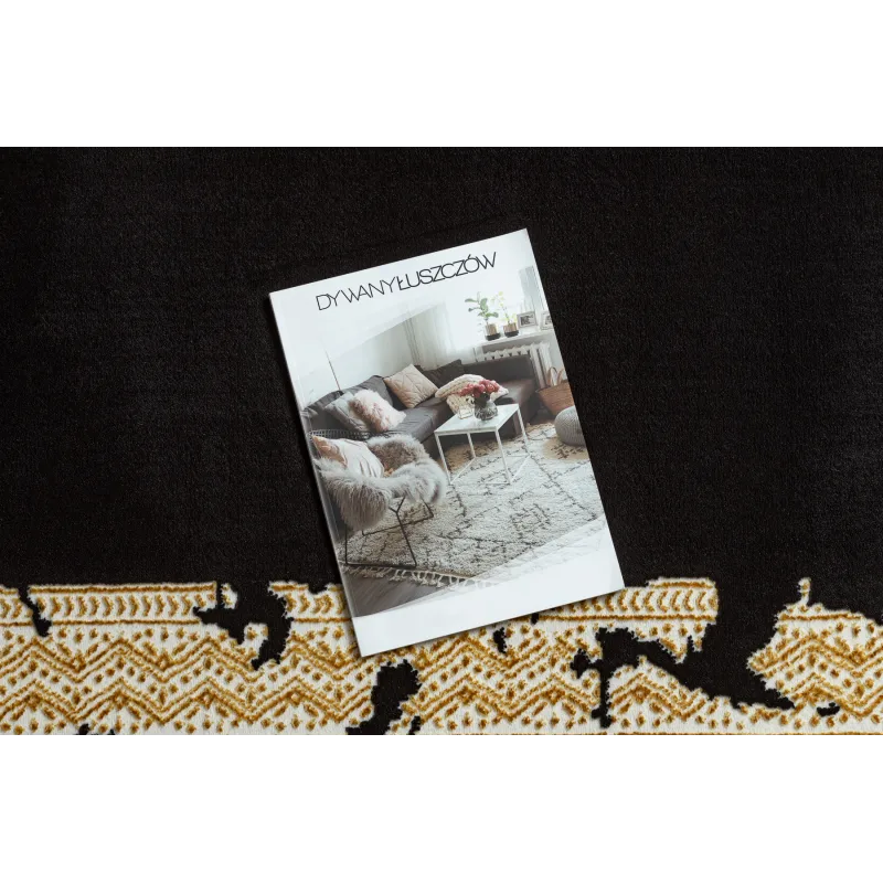 Elegant black and gold rug, perfect for contemporary interiors