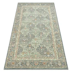SOHO 477.27 wool rug featuring geometric diamond patterns in natural green and blue