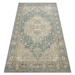 SOHO wool rug featuring a green and blue ornament design