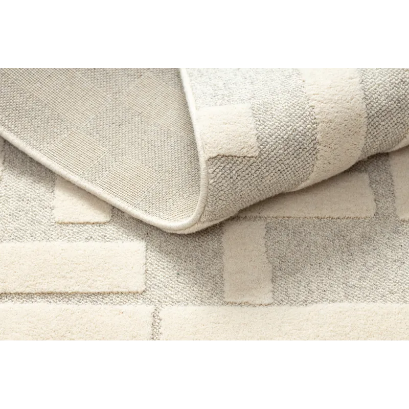 Wool rug with a loft character, structured in beige shade