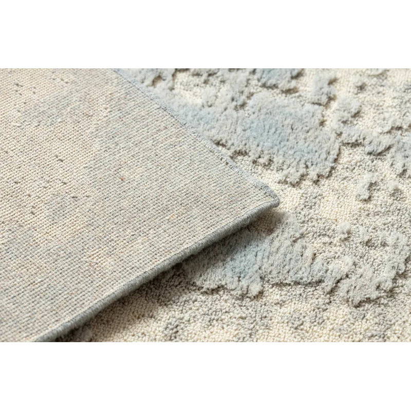 FLUX wool rug with a textured surface, perfect for contemporary living spaces