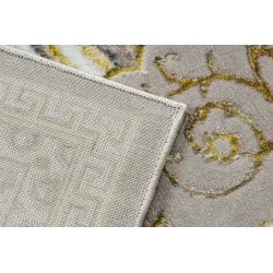 Textured beige rug, perfect for living room or bedroom decor