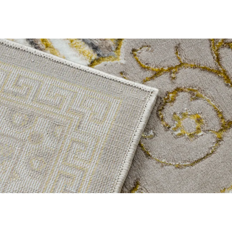 Textured beige rug, perfect for living room or bedroom decor