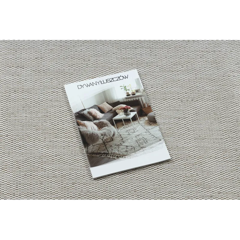 Stone-colored sisal rug - a chic addition to any interior space