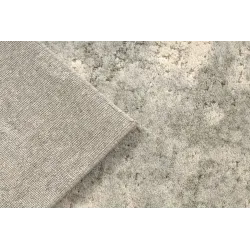 Textured FLUX wool rug 461.121.SA991 with an abstract pattern