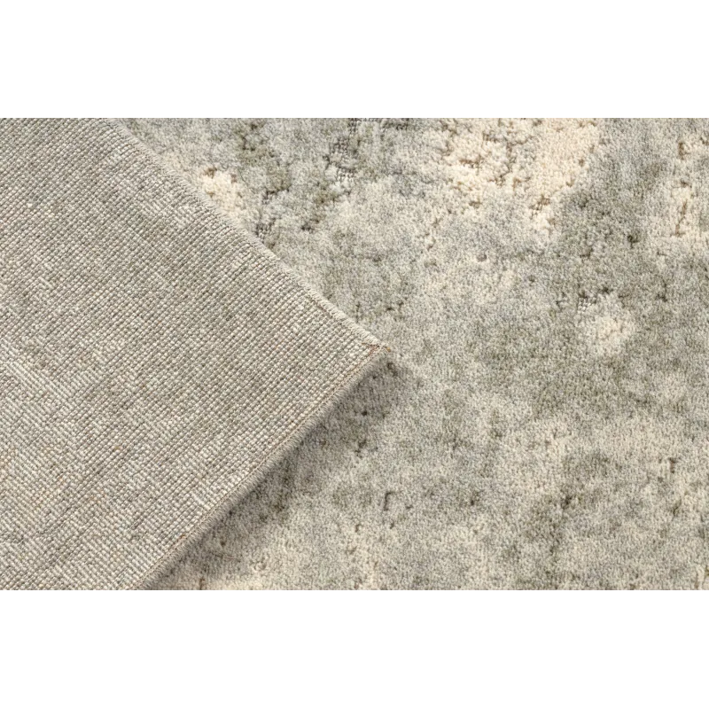 Textured FLUX wool rug 461.121.SA991 with an abstract pattern